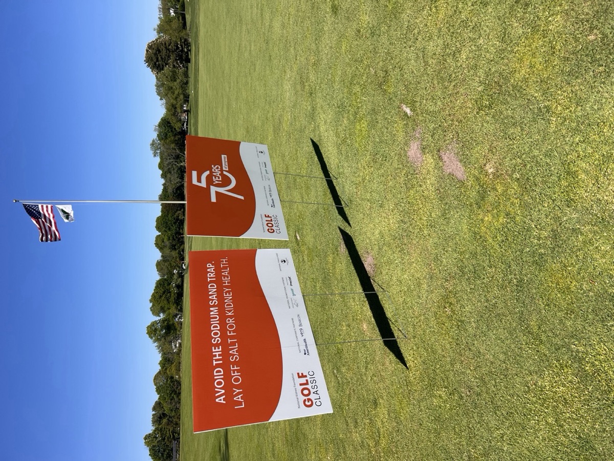 A 75 Years of Progress sign at the 2026 NKF Golf Classic