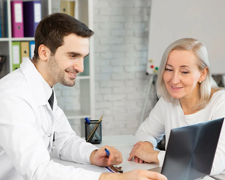 Physician reviewing results with an older patient