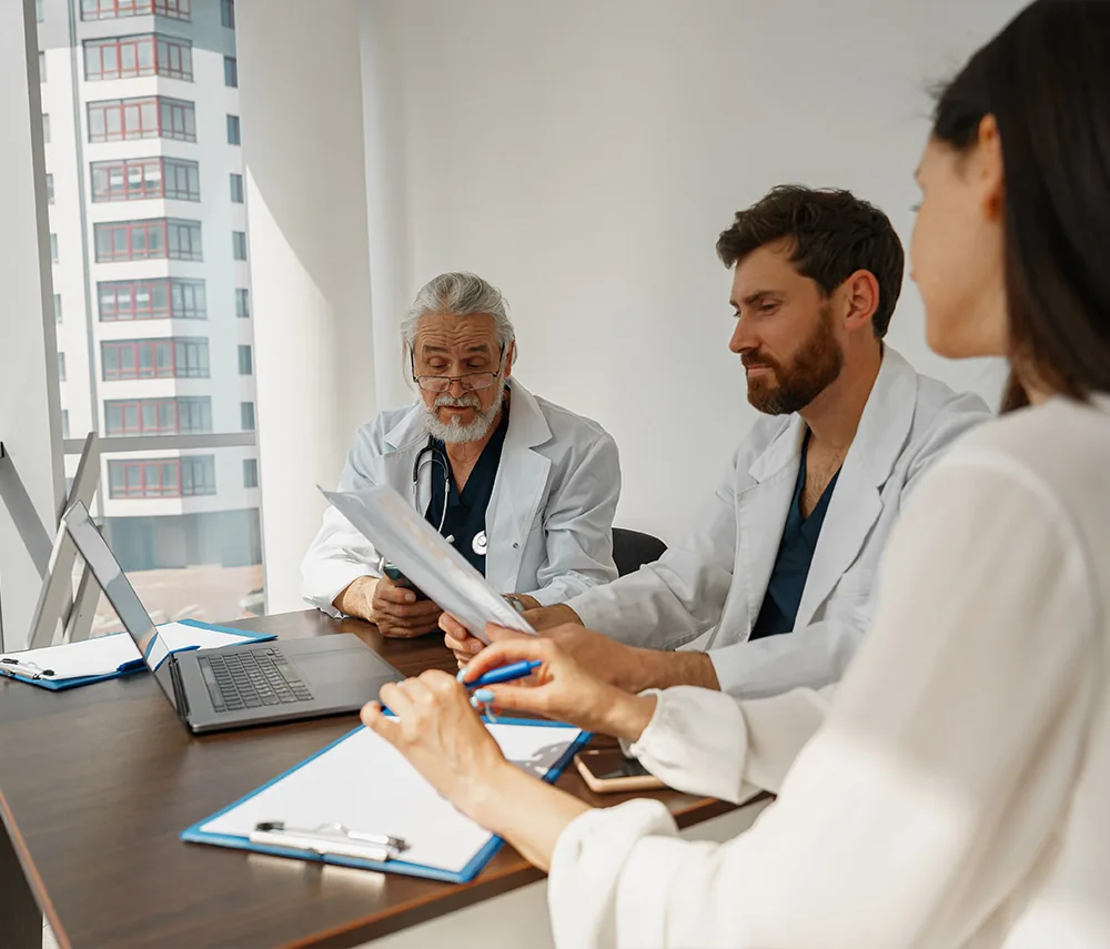 Clinicians meeting around a table