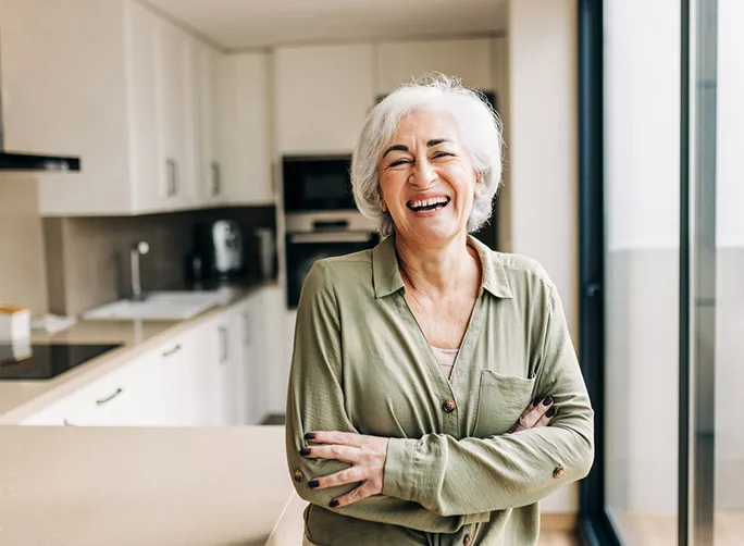 Older woman smiling at home