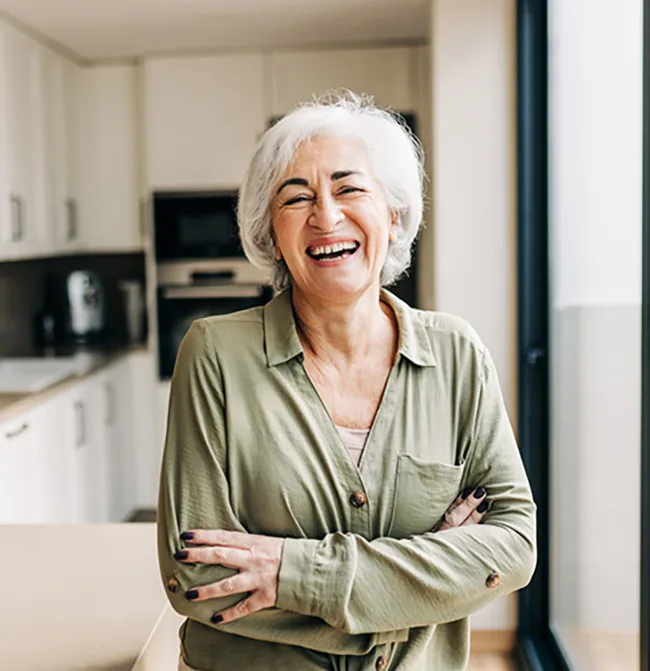 Older woman smiling at home